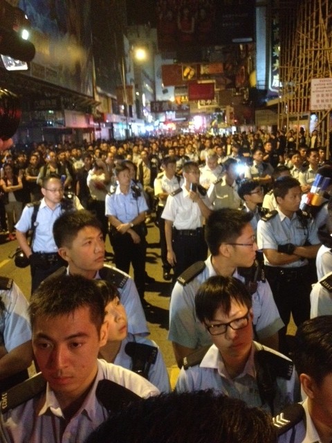 Angry confrontations and a heavy police presence in Mong Kok on Sunday. Photo: Peter So