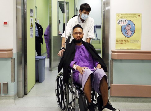 Ken Tsang, a member of a local pro-democracy political party appeares at a hospital to examine his condition of an injury during a clash between protesters and police in an occupied area near government headquarters in Hong Kong Wednesday, Oct. 15, 2014. Photo: AP