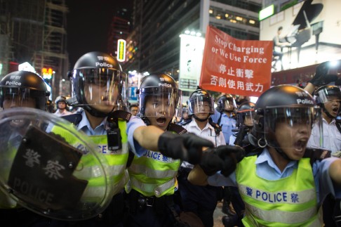 Police used batons and pepper spray to push back the crowds. Photo: AFP