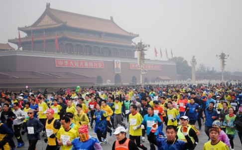 Runners take part in the 34th Beijing International Marathon which began at Tiananmen Square in Beijing. Photo: AFP
