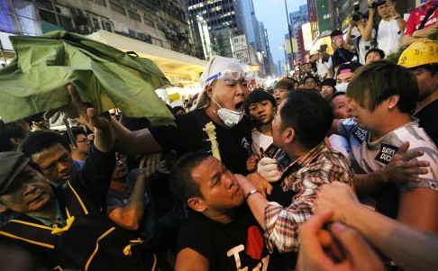 Scuffles break out between Occupy protesters and opponents in Mong Kok. Photo: Sam Tsang