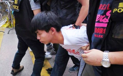 Joshua Wong is taken away by police. Photo: SCMP Pictures