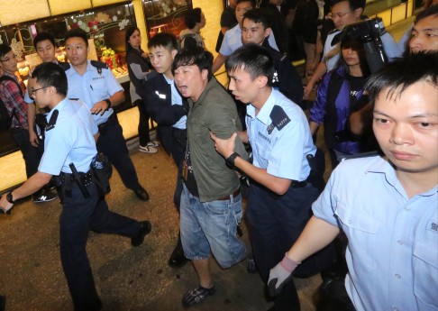 An Apple Daily photographer arrested by police. Photo: Felix Wong
