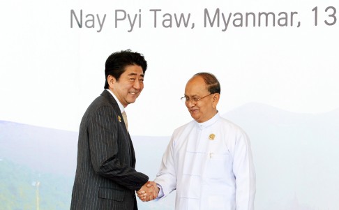 Myanmar's President U Thein Sein (right) welcomes Japanese Prime Minister Shinzo Abe ahead of the 9th East Asia Summit in Nay Pyi Taw, Myanmar. Photo: Xinhua