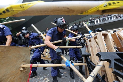 Police and workers demolished barricades.