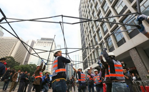 Metal structures are removed from Connaught Road. Photo: Felix Wong