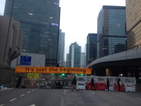'It's just the beginning': a message of defiance painted on a banner at the Occupy protest site