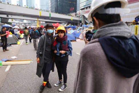 Protesters take a last photo at the Occupy site. Photo: SCMP