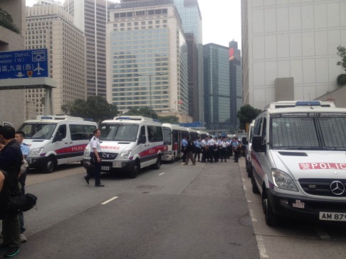 Police vans at the Occupy site. Photo: Alan Yu