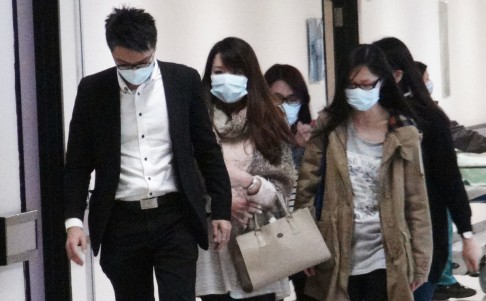 Relatives of Ng Cheuk-yue leave Eastern Hospital yesterday after hearing news of the young man's death. Photos: SCMP Pictures