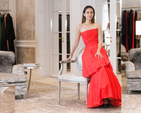 Lam tries on a gorgeous gown during fittings at Dior.