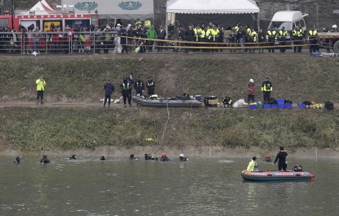 Divers search waters near the crash site yesterday. Photo: Reuters