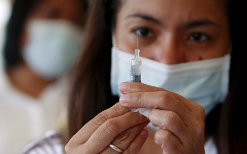 A health worker prepares a flu vaccine in this file photo. The WHO announces the composition of flu vaccines ahead of flu season twice a year. Photo: EPA