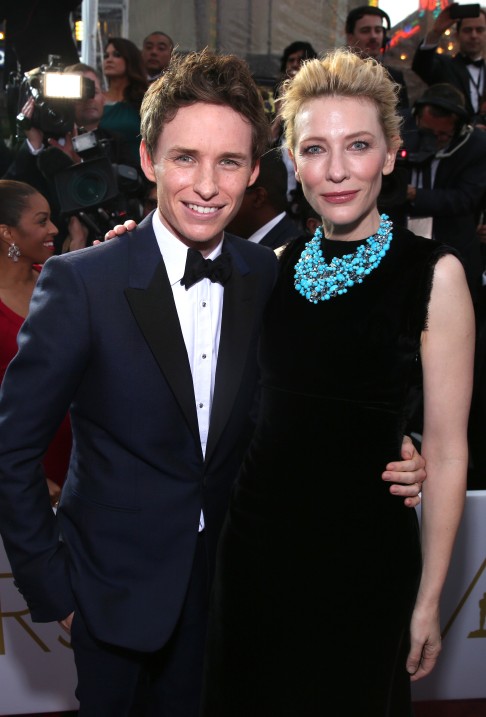 Best actor nominee Eddie Redmayne, in a midnight blue Alexander McQueen tux with black accents, poses with Cate Blanchett. Photo: AP