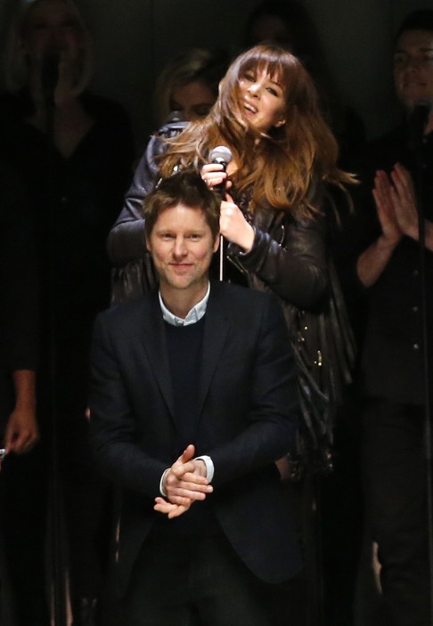 Christopher Bailey applauds singer-songwriter Clare Maguire at the end of the Burberry Prorsum show. Photo: Reuters