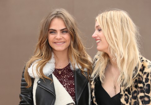 Models Cara Delevingne (left) and Lily Donaldson arrive for the Burberry Prorsum show in London. Photo: AP