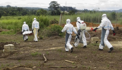 A body is carried to the Ebola graveyard.