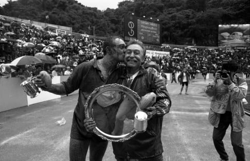 PHOTO 9: Matchwinner Gareth James and coach Jim Rowark celebrate Hong Kong's Plate win in 1992.  
