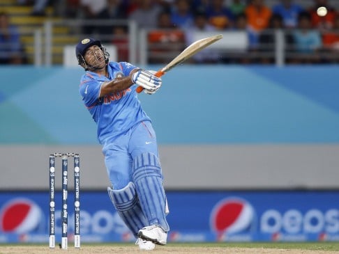 India's Mahendar Singh Dhoni hits a six in their World Cup  match against Zimbabwe at Eden Park in Auckland. Photo: Reuters 