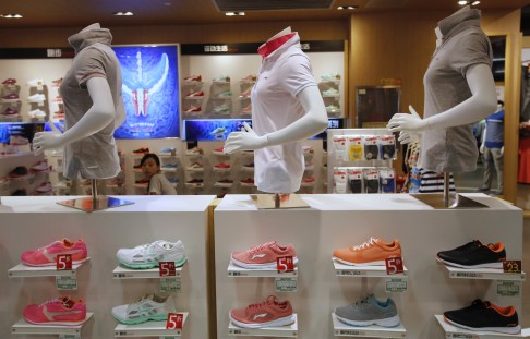 Shelves displaying Li Ning shoes and shirts at a store in Beijing. Photo: Reuters