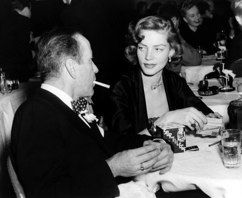 Bacall with Humphrey Bogart at a New York club in 1950. Photo: AP