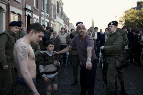 Yann Demange (centre) directs actors Jack O’Connell and Harry Verity (left and top left) in ’71, about a young British soldier cut off from his unit in Belfast during the Troubles.