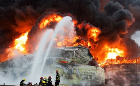 Firefighters battle the blaze. Photo: Xinhua