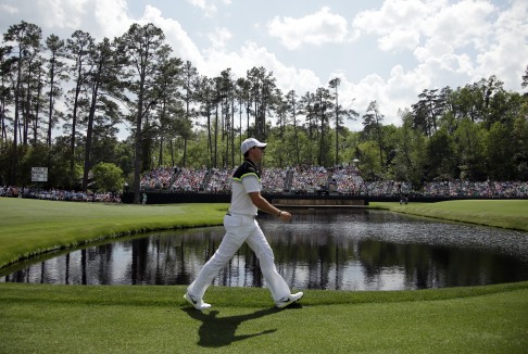 Rory McIlroy walks down the 15th fairway. Photo: AP