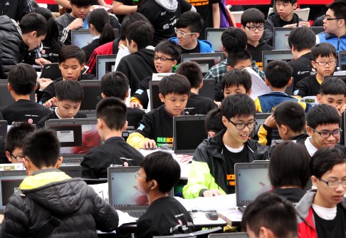 Young people take part in the Cyberport Youth Coding Jam 1000, an attempt to set a world record for most under 18 year olds coding at once on April 9, 2015. Photo: May Tse