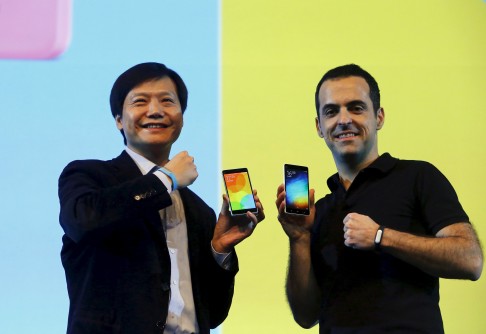 Xiaomi founder Lei Jun on stage in New Delhi with the company's global operations head Hugo Barra. Photo: Reuters