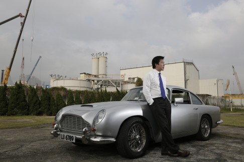 Carl Yuen with one of his classic cars, an Aston Martin DB5.