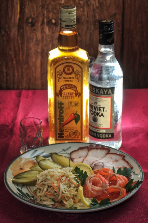 Cured fish, pickles, cold cuts, pork with Ukrainian honey pepper vodka and Priviet vodka (above) at Ivan The Kozak (below).