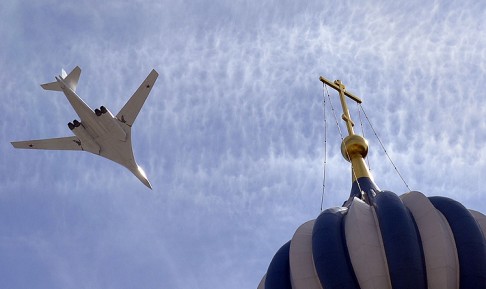 A Tu-160 supersonic strategic bomber flies over Red Square during the celebrations. Photo: AFP