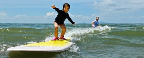 Learning to surf at Pui O. Photo: Hunt Smith