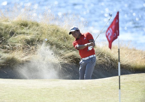 Andres Romero holes out from a bunker on the 15th hole. Photo: USA TODAY Sports