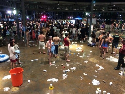 Debris and shocked revellers pictured in the aftermath of the fire at Formosa Fun Coast, a water park just outside Taipei. Photo: Central News Agency