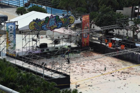 Charred objects remain at the site of the explosion, which came during a dance party at the water park. Photo: AFP