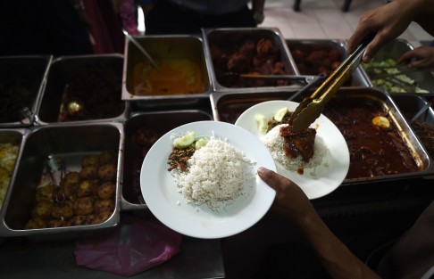 A more conventional version of Malaysia's national dish is served at the Nasi Lemak Tanglin stall in Kuala Lumpur. Photo: AFP