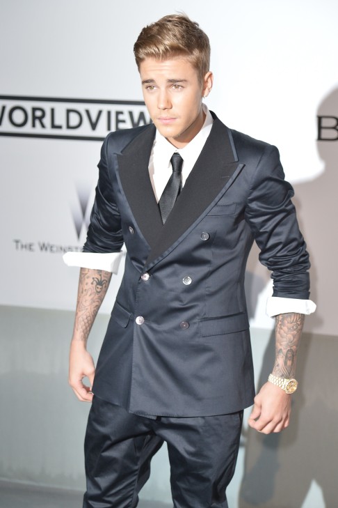 A sharp-dressed Bieber at the 2014 Cannes film festival. Photo: AFP