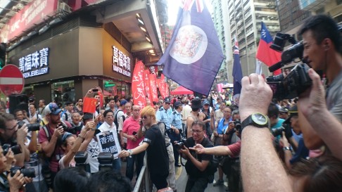 Pro-democracy and Beijing-loyalist protesters are kept apart in Wan Chai. Photo: Emily Tsang