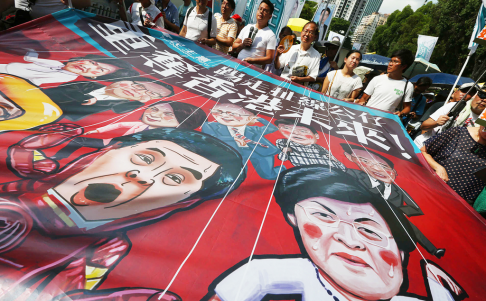 Banners poke fun at government figures such as Chief Executive Leung Chun-ying. Photo: Felix Wong