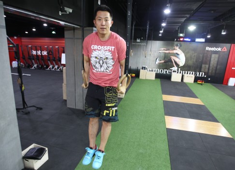 Wang's gym members practise crossfit, a high-intensity interval workout programme that combines elements from various sports including gymnastics. Photo: Simon Song