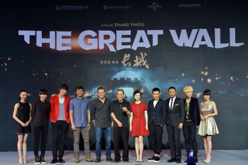Director Zhang Yimou (centre) is flanked by co-stars Matt Damon and Jing Tian in a cast photo. 