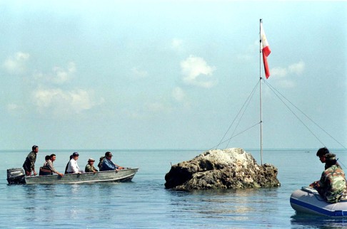 A team of Philippine navy and congressional leaders sail to Scarborough Shoal in the South China Sea for an inspection trip in 1997. China seized the rock formation from Manila in 2012. Photo: Reuters 