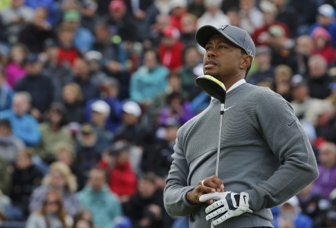 Tiger Woods watches a shot on 17. Photo: Reuters