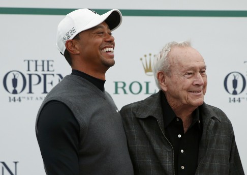 Tiger Woods with Arnold Palmer before the first round. Photo: AFP
