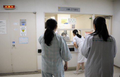 A Chinese tourist awaits the results of an X-ray at a hospital in Japan's Hokkaido prefecture. Photo: AFP 