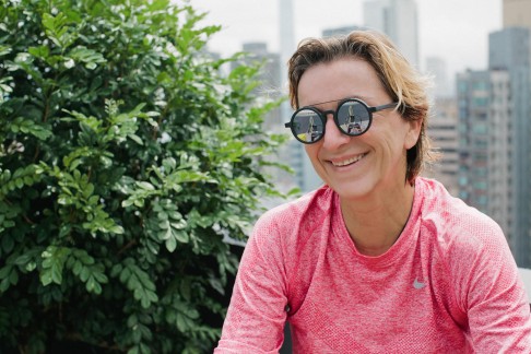 Barbier wears second-generation Shanghai Tang sunglasses and a Nike top.