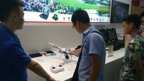 Amid burgeoning demand, Chinese shoppers look at the drones available at a local trade fair. Photo: SCMP Pictures