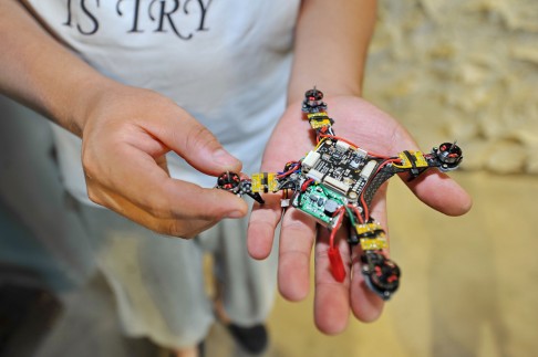 Young entrepreneurs in northeast China's Jilin province showed off an automatic-tracking drone this week. The two Jilin University graduates, Gao Hua and Hou Xiaoye, founded their 'geek studio' to facilitate innovation in areas like 3D printers, drones and wearable virtual reality headsets, they said. Photo: Xinhua